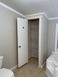 Large linen and storage closet in the master bath.