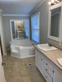 View of the soaking tub, with a built-in step.