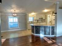 Looking into the kitchen, all appliances are staying including the REFRIGERATOR!