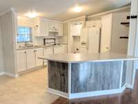 Nice spacious kitchen, subway tile backsplash, lots of cabinets and counter space. Notice all accent walls throughout this home are the same!