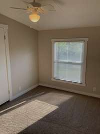 Another secondary bedroom ceiling fan, like new carpet, and lots of natural light. Three of the four bedrooms face the front of this home and one of the secondary bedrooms face the back of the home.