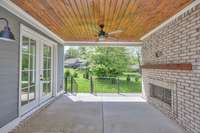 Covered patio on the main floor with a gas fireplace. A great space for entertaining.