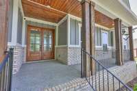 Inviting front porch with room for seating.