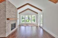 Gorgeous stained beams and a gas fireplace in the Family Room.