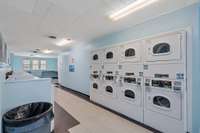 Multiple washers and dyers for residents to use.