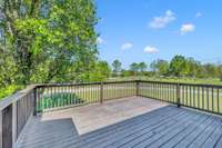 The 18x16 massive back deck offers stunning views, providing the perfect setting for outdoor gatherings and relaxation. 1138 Weeks Rd  Murfreesboro, TN 37127