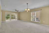 The enclosed Sunroom towards the back is an extension to this large open space.