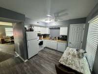 Bright white cabinetry with pantry …