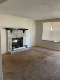 Embrace the charm of the fireplace and envision the possibilities for your investment.