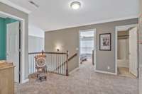 Upstairs landing with newer carpet throughout the entire upstairs.