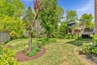 Beautiful landscaped yard with mature trees and more!