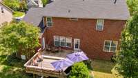 Aerial view of large, oversized deck with built in bench sitting!