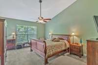 Large primary bedroom on the main level with vaulted ceiling!