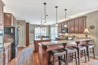 Fabulous kitchen with granite, built in oven, gas cooktop, above and below cabinet lights.