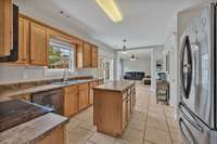 Eat-in kitchen with large windows and lots of natural light.