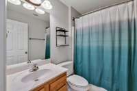 Upstairs hallway bath with shower/tub combo.