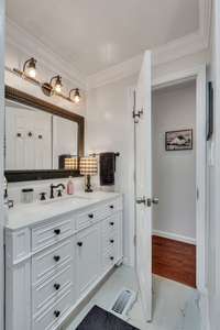 Guest bath features, new vanity, toilet, skylight window and new flooring.