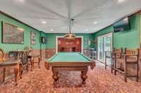 Pool room. Pool Table conveys with property.