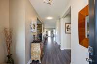 Front Foyer entry way features "bench drop area", upgraded light fixtures