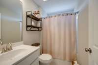 FULL BATH located inside bedroom #3 Bathroom 4 of 4 Curved shower curtain rod gives user extra space!