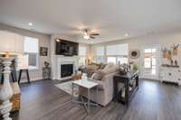 Open floor plan, gas fireplace. Back door leads to screened patio.