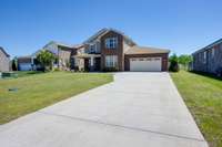 Extra long concrete driveway, plenty of exterior parking + 2-car garage Keyless Entry Front Door & Garage Door