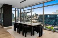 Separate dining area with updated Restoration Hardware fixture to enjoy dinner while watching the Nashville skyline.