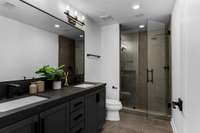 Guest bath with dual vanities and large walk in shower.