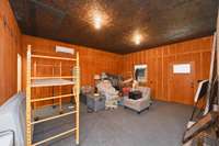 Downstairs bedroom in carriage house currently used for storage.