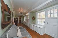 This was originally called the “lamp hall” as the far cabinet was where the lamps were stored for the home. The closer cabinet contains the original sink (non-functioning) as the cabinet was used for gardening.