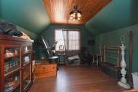 Guests will love the upstairs bedroom in the carriage house. It’s currently used for storage.