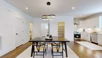 Dining / Kitchen area with half bath, laundry, pantry and closet.