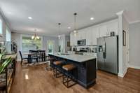 Open seating, eat-in kitchen, with large island.