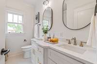 Main level bath with double vanities