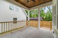 Enjoy outdoor lounging and dining in your covered porch next to the family room