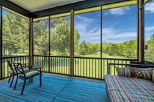 Covered and screened back deck with beautiful view