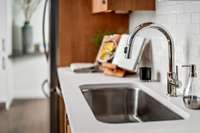 All units feature Delta plumbing fixtures | Photo from our Furnished B2 Model