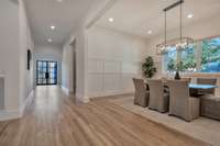 A look from the center hallway toward the front door.  The spacious dining room is on the right.