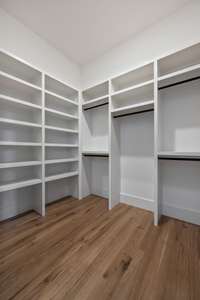 Another expansive closet serves the second downstairs primary bedroom.