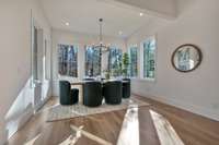 The large breakfast area overlooks the wooded back yard.