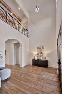 Another look at the entry foyer.  Notice the beautiful beams on the second floor above.