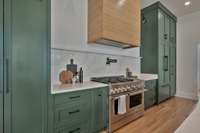 No luxury was forgotten in this kitchen.  The refrigerator is concealed behind the cabinetry on the right.