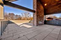 Another look at the stone fireplace and impressive architecture of the rooftop terrace.