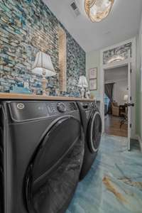 A laundry room surround in elegant tile...