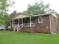 Side view of home. Notice metal door on right side to storage under home. See pictures below.