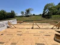 Sun deck looking over rear yard. *this home is under construction Photo taken 6/25/24