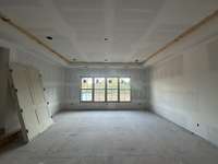 Upper-level Game Room with a full wet bar. *this home is under construction Photo taken 9/6/24