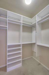 California closet system in owners closet