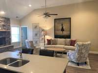 Stock photo of great room/kitchen with high ceilings