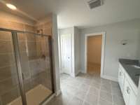 Primary bath with double vanity and walk in shower